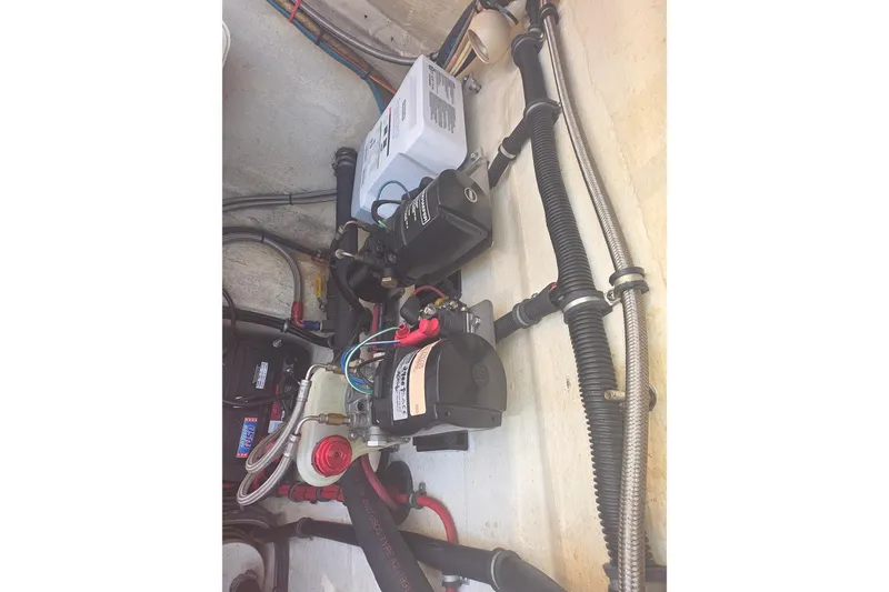 Slide: The Image of Electrical components and wiring inside a 1992 Fountain boat. - 10