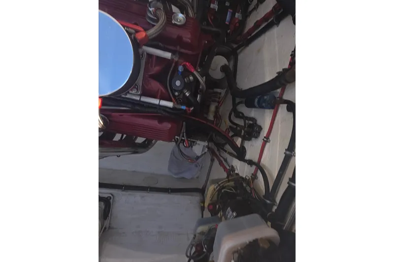 Slide: The Image of Engine compartment of a 1992 Fountain boat with visible components and wiring. - 11