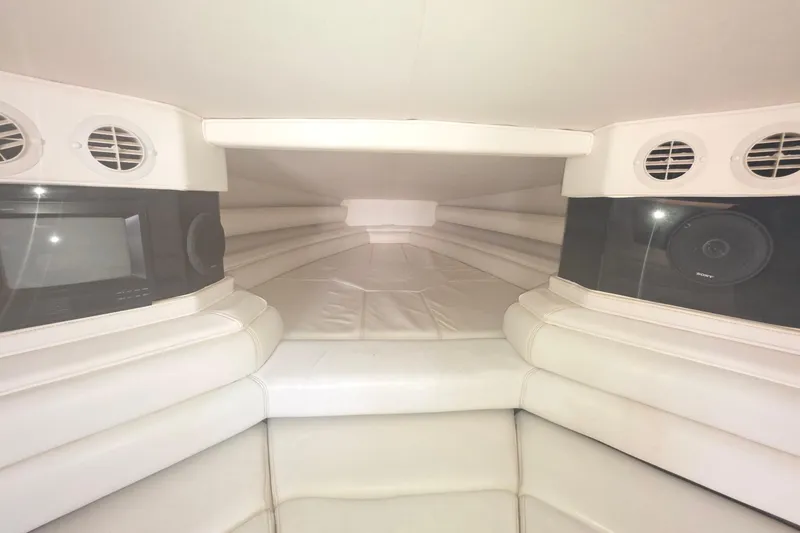 Slide: The Image of Interior of a 1992 Fountain boat with white leather seating and built-in speakers. - 21