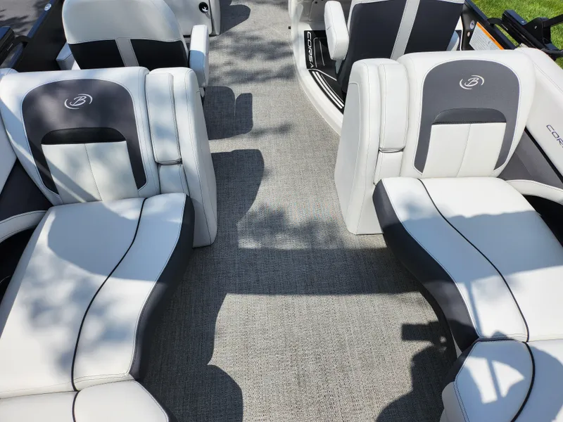 Slide: The Image of 2021 Barletta CORSA 23QC boat interior with gray and white seating. - 18