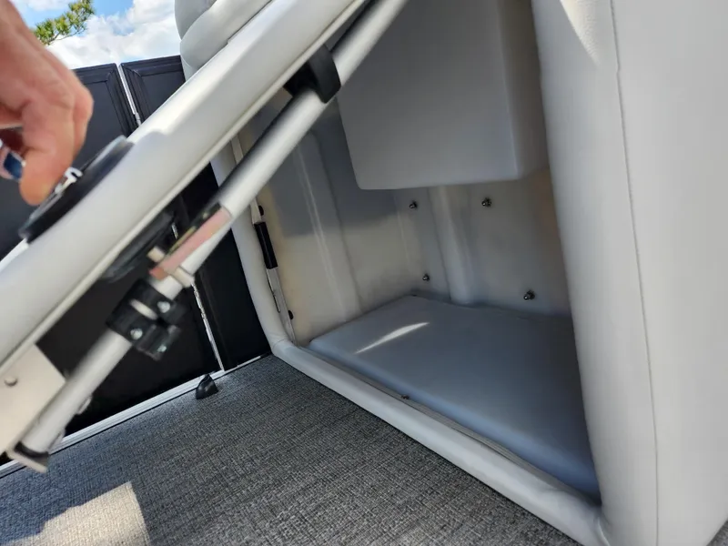 Slide: The Image of Open storage compartment in 2021 Barletta CORSA 23QC boat, featuring cushioned seating. - 21
