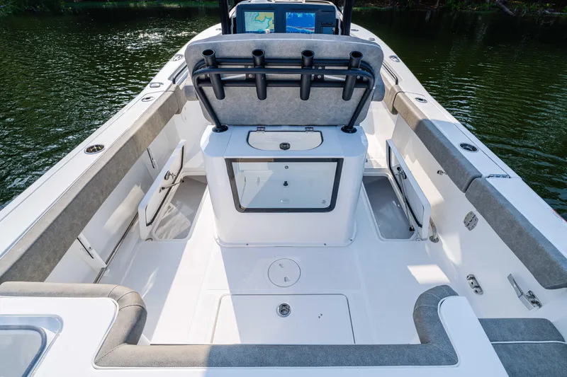Slide: The Image of 2026 Sea Hunt Gamefish 25 boat interior with rod holders and storage compartments. - 10