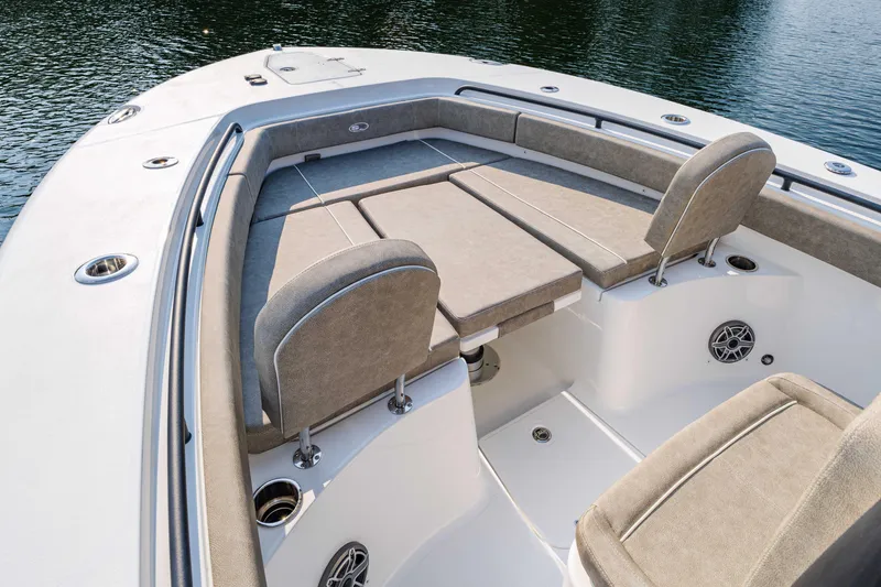 Slide: The Image of 2026 Sea Hunt Gamefish 25 boat interior with cushioned seating and cup holders. - 4