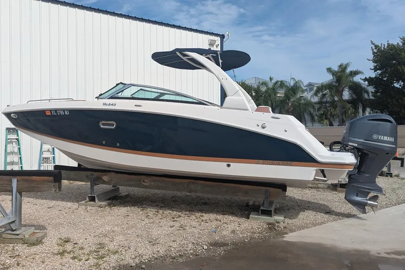 Slide: The Image of 2017 Four Winns HD240 OB boat with Yamaha outboard motor on display. - 1