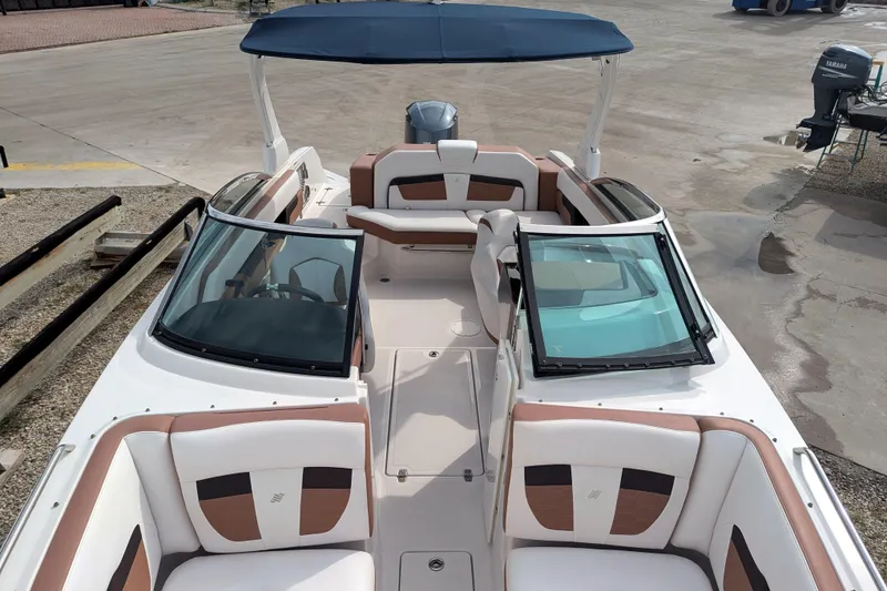 Slide: The Image of 2017 Four Winns HD240 OB boat with spacious seating and sleek design. - 12