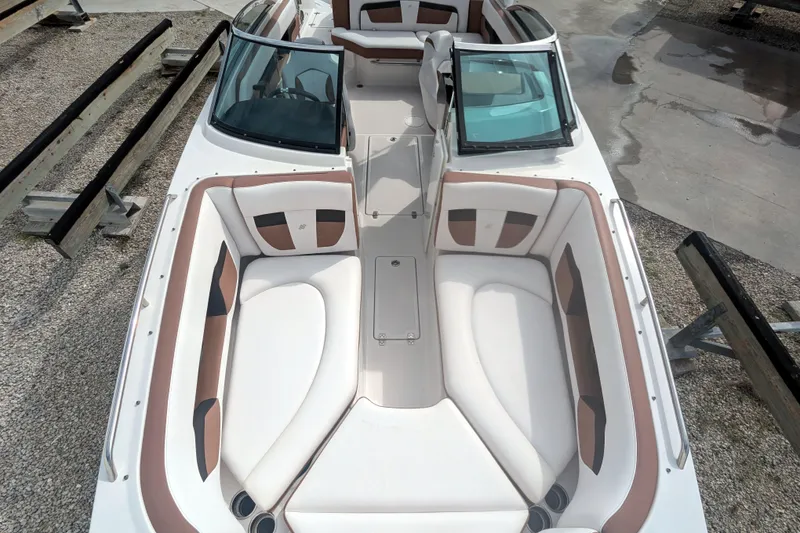 Slide: The Image of 2017 Four Winns HD240 OB boat interior with spacious seating and modern design. - 14