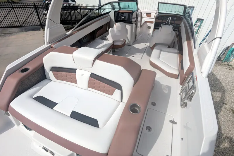Slide: The Image of 2017 Four Winns HD240 OB boat interior with spacious seating and modern design. - 16