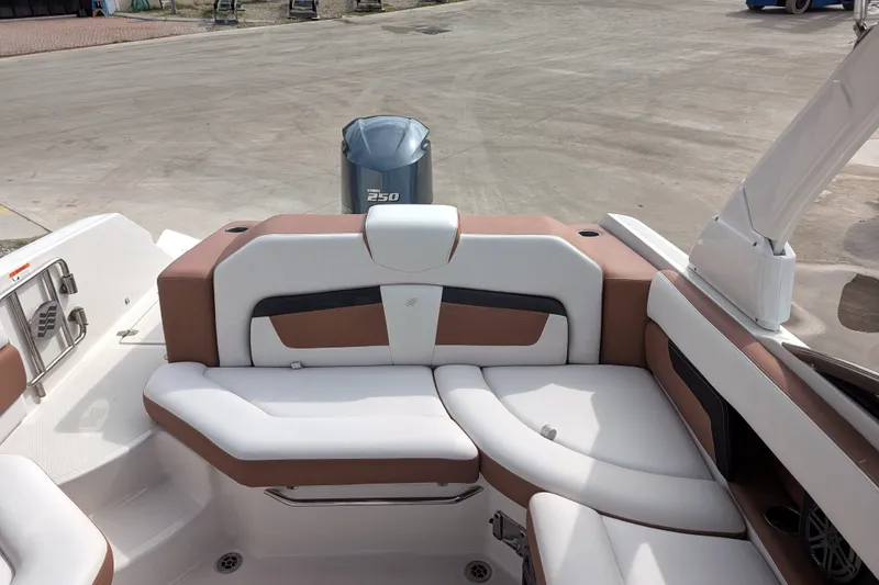 Slide: The Image of 2017 Four Winns HD240 OB boat interior with Yamaha 250 outboard motor. - 17