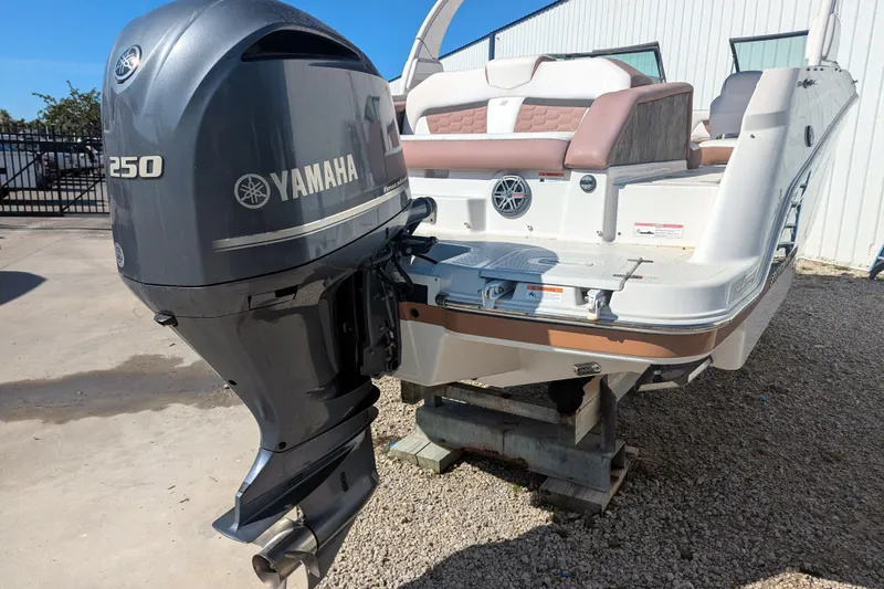 Slide: The Image of 2017 Four Winns HD240 OB boat with Yamaha 250 outboard motor, displayed outdoors. - 18