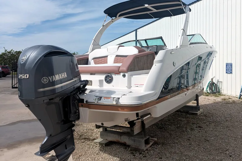 Slide: The Image of 2017 Four Winns HD240 OB boat with Yamaha 250 outboard motor, displayed outdoors. - 2