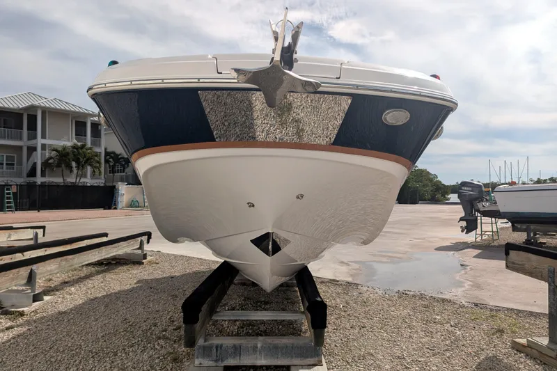 Slide: The Image of 2017 Four Winns HD240 OB boat on dry dock, front view. - 3