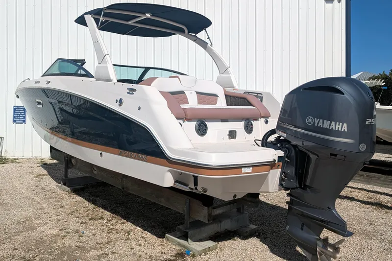 Slide: The Image of 2017 Four Winns HD240 OB boat with Yamaha 250 outboard motor, docked outdoors. - 4