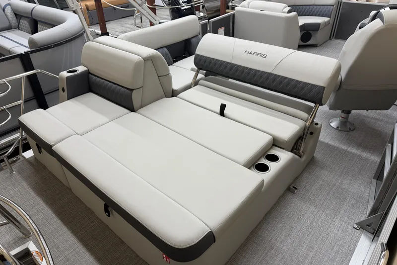 Slide: The Image of 2026 Harris Cruiser 190 boat interior with luxurious seating and cup holders. - 10