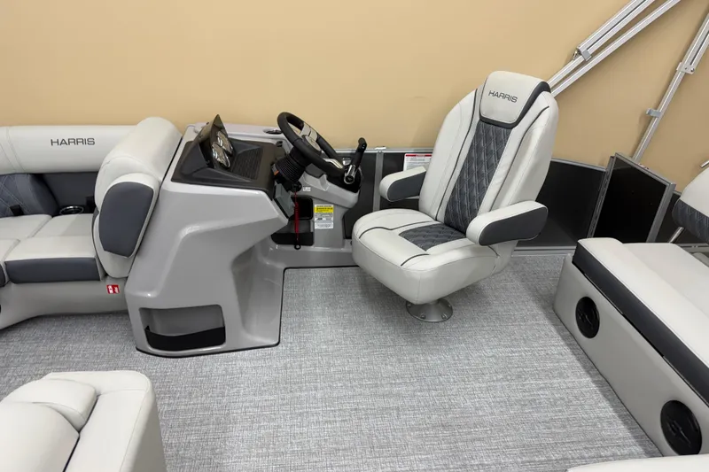 Slide: The Image of 2026 Harris Cruiser 190 boat interior with modern helm and comfortable seating. - 4