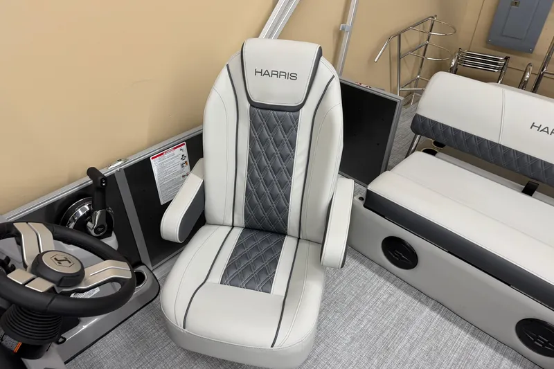 Slide: The Image of 2026 Harris Cruiser 190 boat interior with luxury seating and steering wheel. - 5