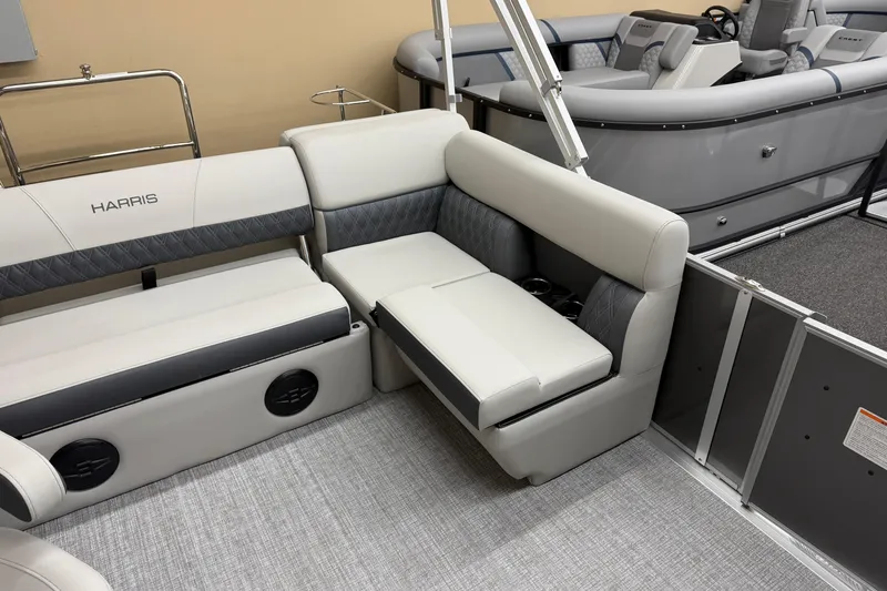 Slide: The Image of 2026 Harris Cruiser 190 boat interior with plush seating and modern design. - 7