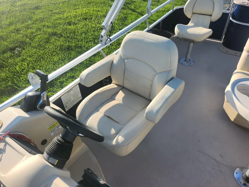 Slide: The Image of 2018 SunChaser Geneva Cruise 22 DLX 4.0 Fish boat interior with beige captain's chair. - 16