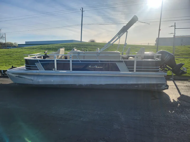 Slide: The Image of 2018 SunChaser Geneva Cruise 22 DLX 4.0 Fish pontoon boat on pavement, sunny day. - 4