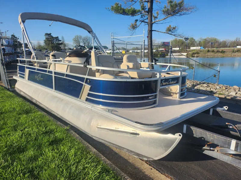 Slide: The Image of 2018 SunChaser Geneva Cruise 22 DLX 4.0 Fish pontoon boat docked by a lake. - 8