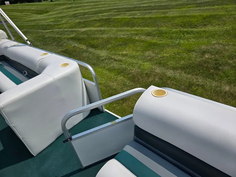 Slide: The Image of Pontoon boat seating on 2000 Odyssey Pontoons 2505 Millennium, with green and white upholstery. - 11