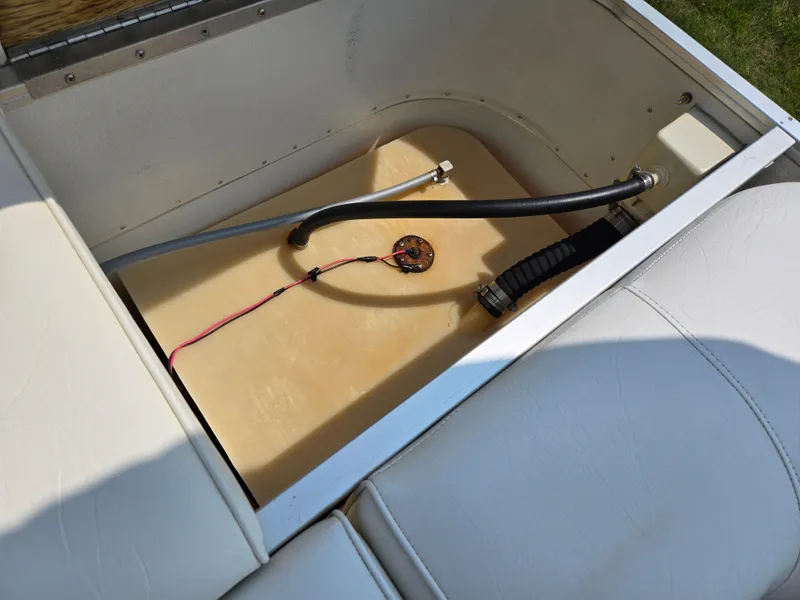 Slide: The Image of Open storage compartment in 2000 Odyssey Pontoons 2505 Millennium boat. - 18