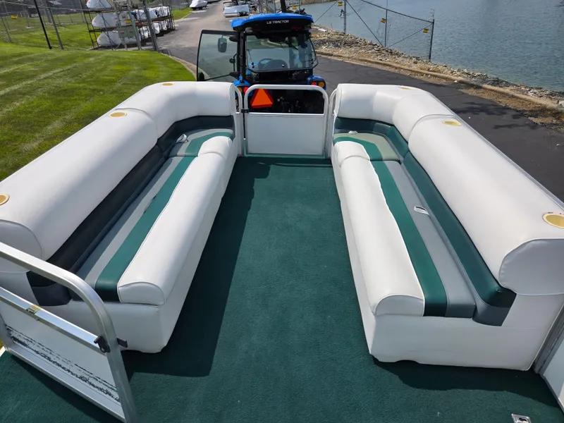 Slide: The Image of 2000 Odyssey Pontoons 2505 Millennium interior with spacious seating and green carpet. - 24