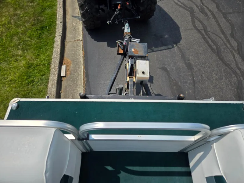 Slide: The Image of Top view of a 2000 Odyssey Pontoons 2505 Millennium being towed on a road. - 26