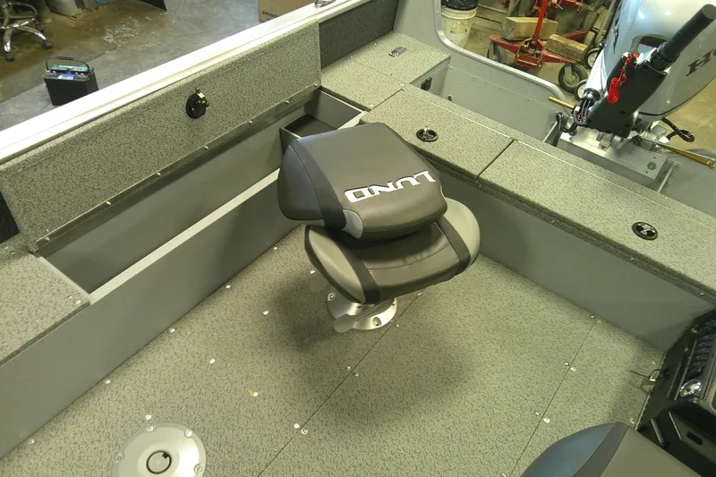 Slide: The Image of 2026 Lund 1700 Explorer Tiller boat interior with swivel seat and motor. - 10