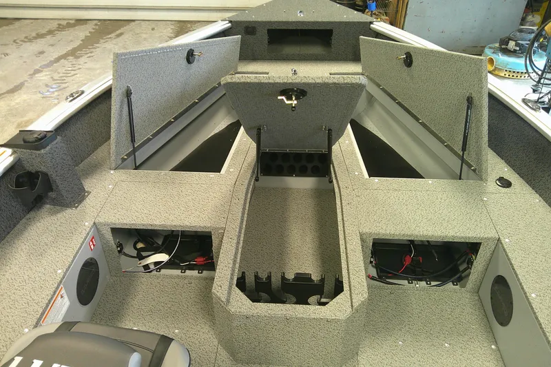 Slide: The Image of 2026 Lund 1700 Explorer Tiller boat interior with open storage compartments. - 7