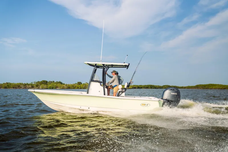Slide: The Image of 2026 Sea Hunt BX 22 BR boat cruising on open water under a clear sky. - 6