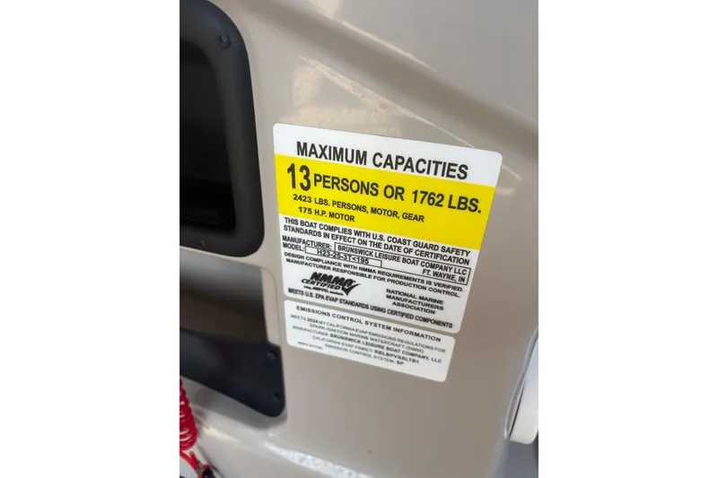 Slide: The Image of 2024 Harris HCX23 boat capacity label, maximum 13 persons or 1762 lbs, 175 HP motor. - 7