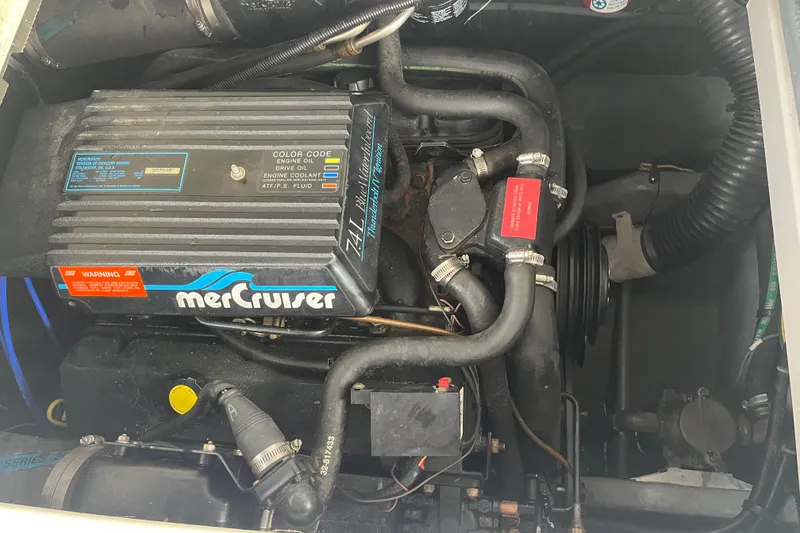 Slide: The Image of Engine compartment of a 1994 Sea Ray 310 Amberjack with MerCruiser components. - 34