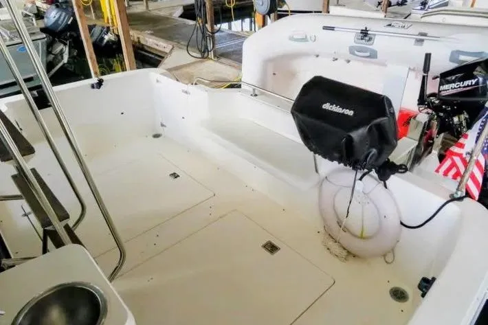 Slide: The Image of 1992 Bayliner 3688 Motoryacht deck with outboard motor and American flag. - 11