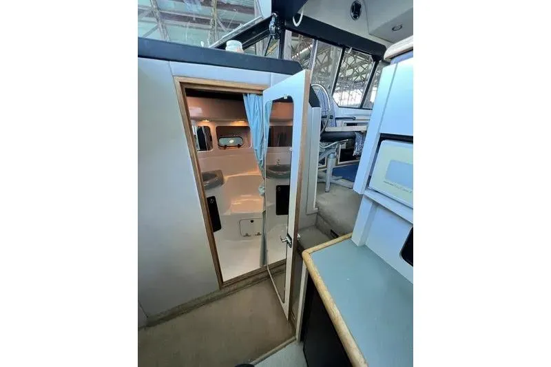 Slide: The Image of Interior view of 1992 Bayliner 3688 Motoryacht cabin with seating and helm area. - 21