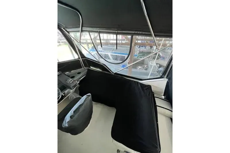 Slide: The Image of Interior view of 1992 Bayliner 3688 Motoryacht cockpit with seating and controls. - 30