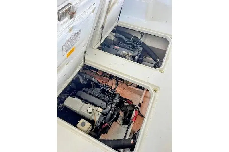 Slide: The Image of Engine compartment of a 1992 Bayliner 3688 Motoryacht, showcasing mechanical components. - 31