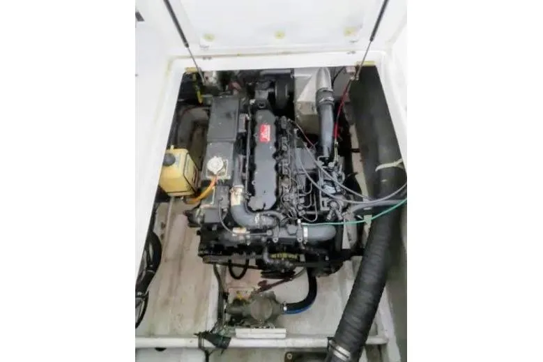 Slide: The Image of Engine compartment of 1992 Bayliner 3688 Motoryacht, showcasing detailed mechanical components. - 32