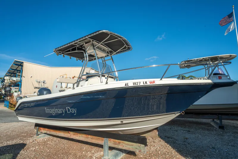 Slide: The Image of Century 2001 boat named "Imaginary Day" on display, clear blue sky background. - 1