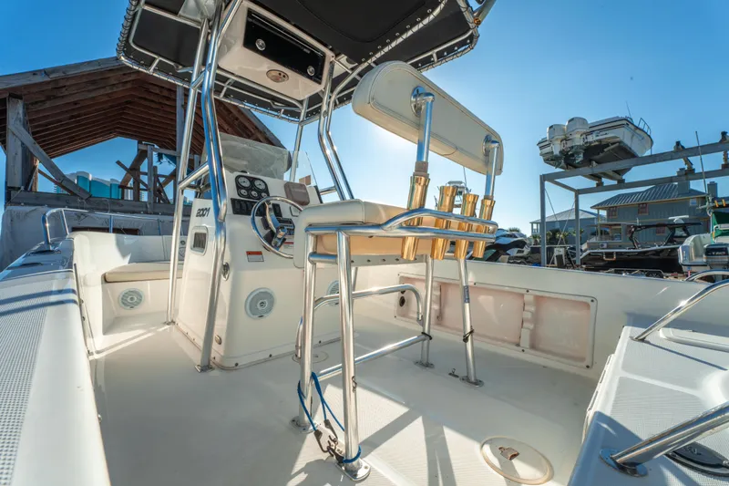 Slide: The Image of Century 2001 model boat interior, 2006, featuring steering console and seating under clear blue sky. - 11