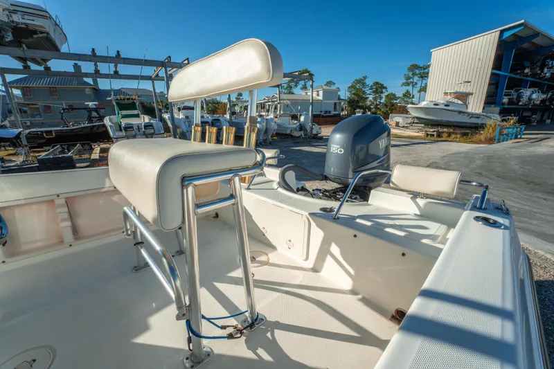 Slide: The Image of Century 2001 model boat, 2006, with Yamaha 150 engine in a marina setting. - 13