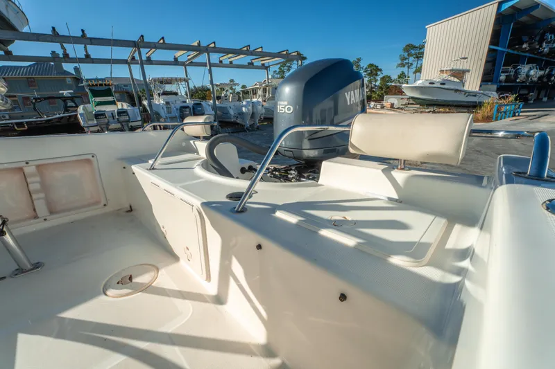 Slide: The Image of Century 2001 model boat, 2006, with Yamaha 150 engine in a marina setting. - 14