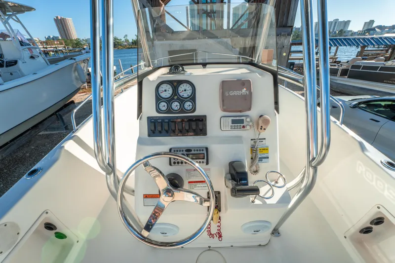 Slide: The Image of Century 2001 boat console, 2006 model, featuring steering wheel and navigation instruments. - 19