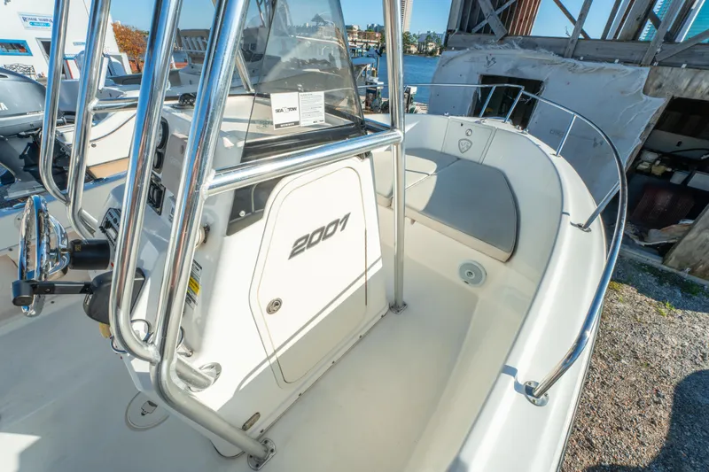 Slide: The Image of Century 2001 model boat, 2006, with steering console and seating, docked near water. - 23