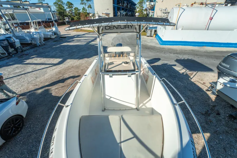 Slide: The Image of Century 2001 model boat, 2006, parked outdoors with surrounding boats and equipment. - 26