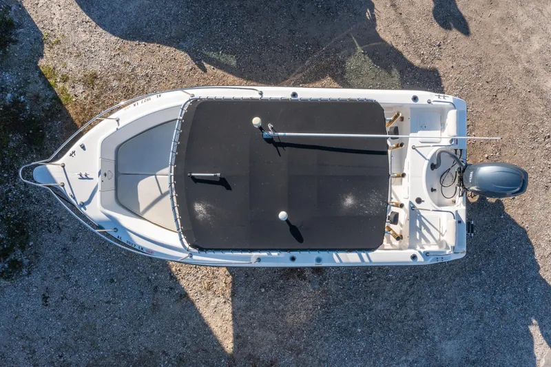 Slide: The Image of Top view of a 2006 Century 2001 model boat on gravel surface. - 29