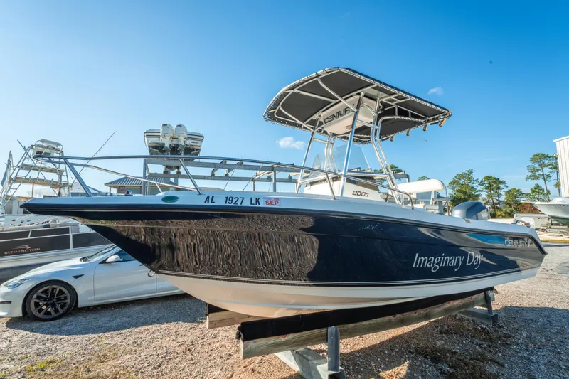 Slide: The Image of Century 2001 boat from 2006, named "Imaginary Day," parked outdoors. - 4