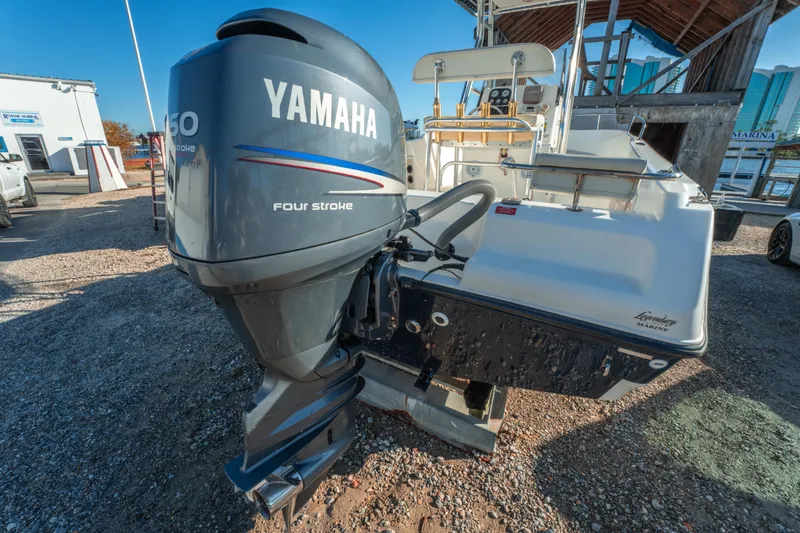 Slide: The Image of Century 2001 boat with Yamaha 150 four-stroke engine, parked outdoors. - 8