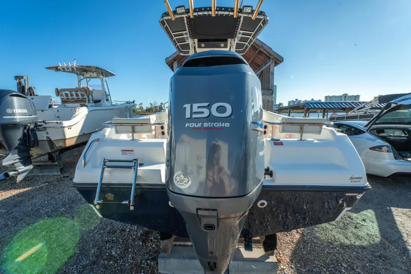 Slide: The Image of Century 2001 boat with Yamaha 150 four-stroke engine, 2006 model, docked outdoors. - 9