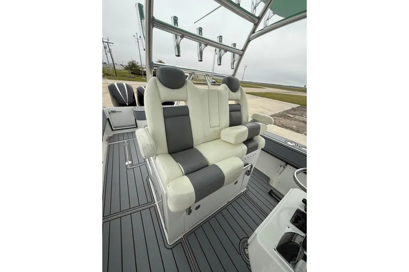 Slide: The Image of 2008 Contender 36 Open boat interior with cushioned seating and rod holders. - 11