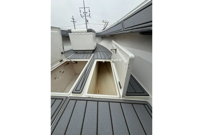 Slide: The Image of 2008 Contender 36 Open boat deck with open storage compartments. - 19